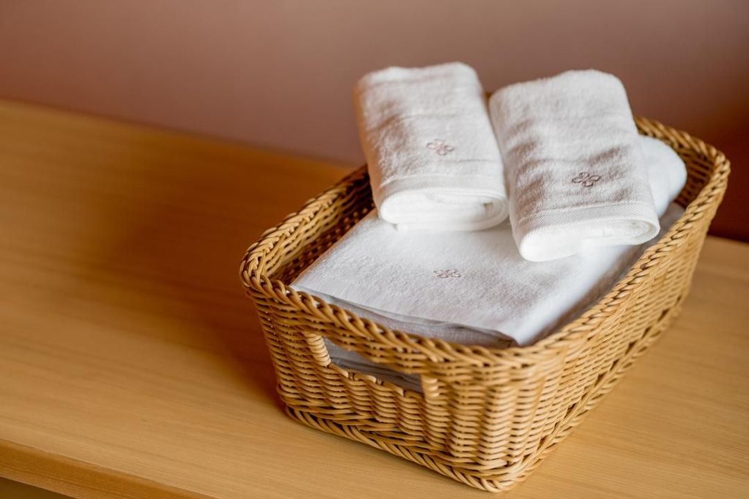 Amenity goods from RESI STAY are in bathroom. Bath towels and face towels are provided.