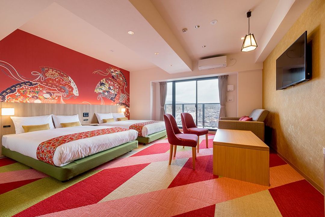 Welcome to THE Nishijin ! This room has two Double beds and a sofa bed. This room has playful "HINA" decorations on the wall.