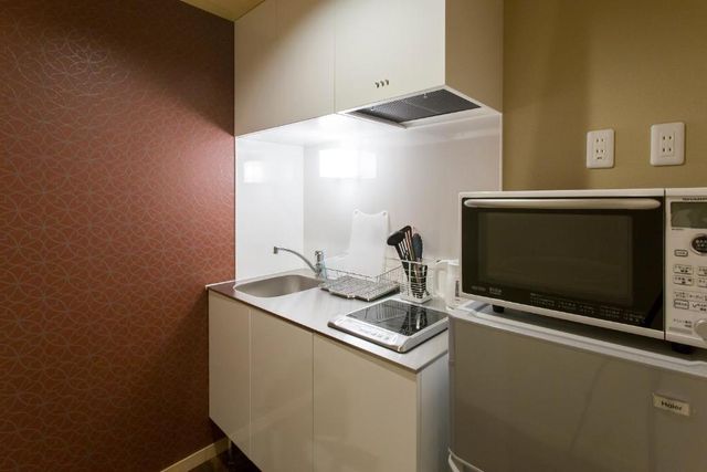 Please use Refrigerator and Microwave. You can cook in the kitchen on the 1st floor.