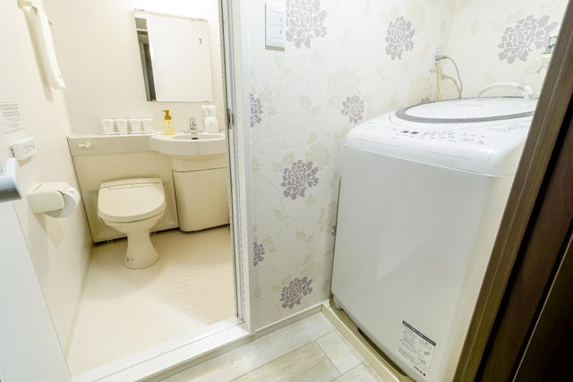 Washing machine is beside the bathroom. You can wash your clothing and  towel like you are staying home.  Detergent ball for washing machine is prepared.