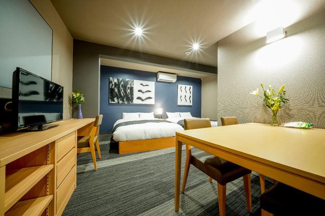 Two double beds are available in this room. You can lay the bed and watch a TV. Talk with your partner, friend, or family and have a dinner here.