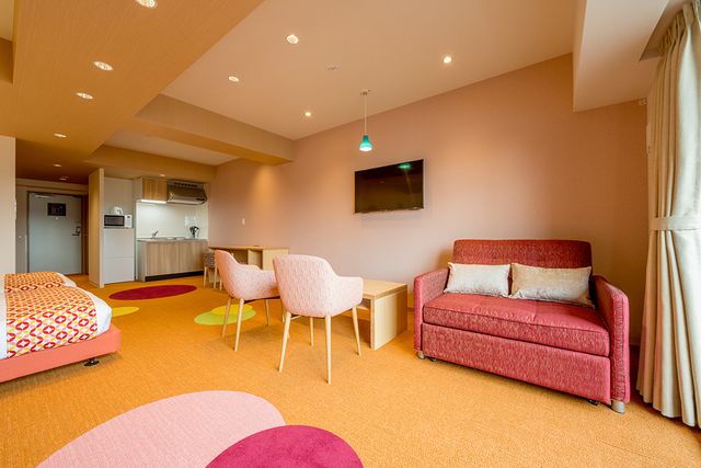 This room has two Double beds and a sofa bed.