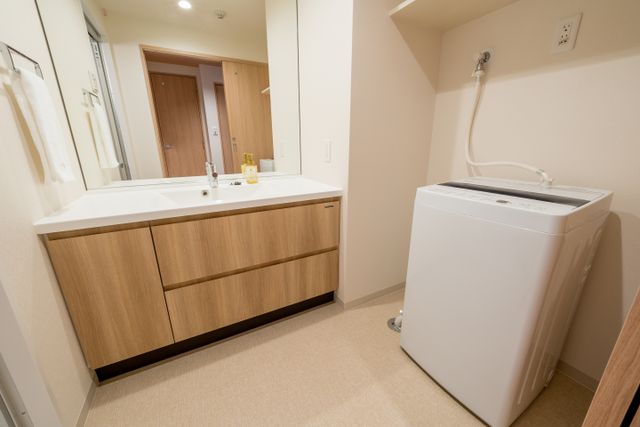 The room has a private bathroom. The toilet is separate. The bathroom has a sink with hand towels and soap and other amenities.
