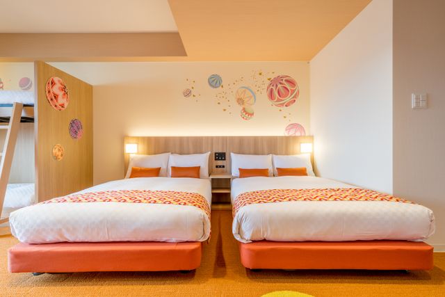 Welcome to THE Nishijin ! This room has two bunk beds, two Double beds and a sofa bed. This room has playful "MARI" decorations on the wall.