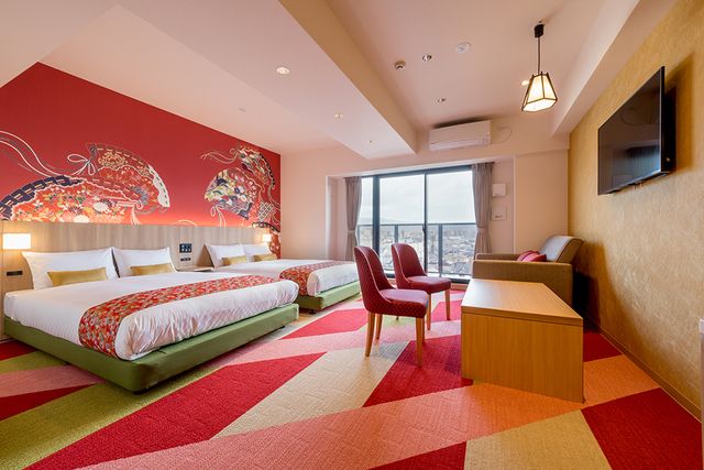 Welcome to THE Nishijin ! This room has two Double beds and a sofa bed. This room has playful "HINA" decorations on the wall.