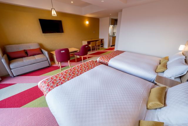 The view of 2 double beds and sofa bed.