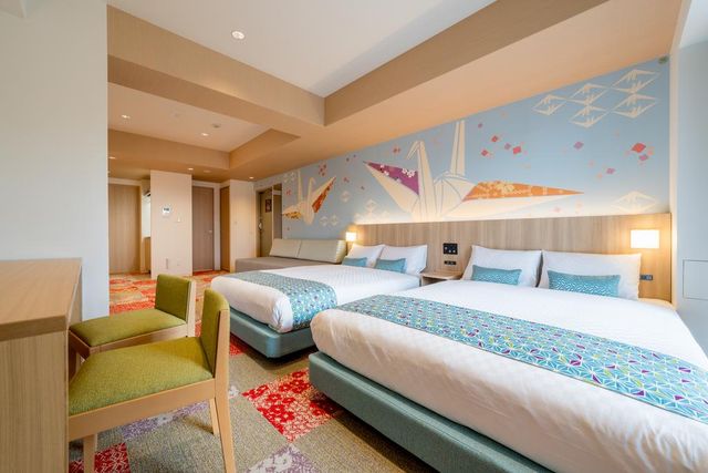Welcome to THE Nishijin ! This room has two Double beds and a sofa bed. This room has playful "ORIGAMI" decorations on the wall.