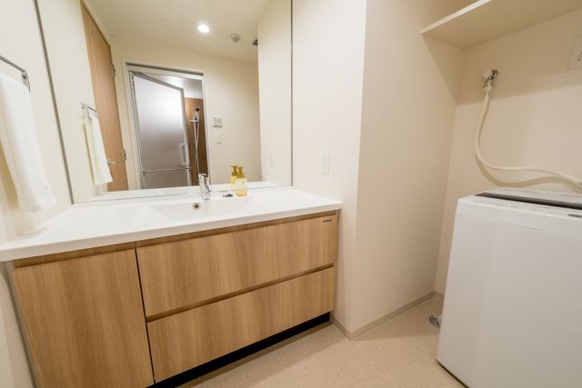 Washing machine is equipped in the room.