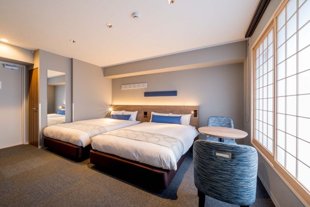 This room has two double beds.